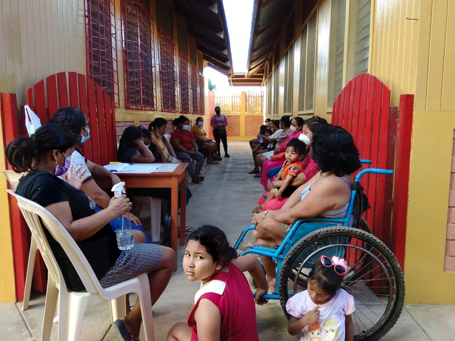 Patients wait to be seen at the medical dispensary for covid symptoms and dengue fever.